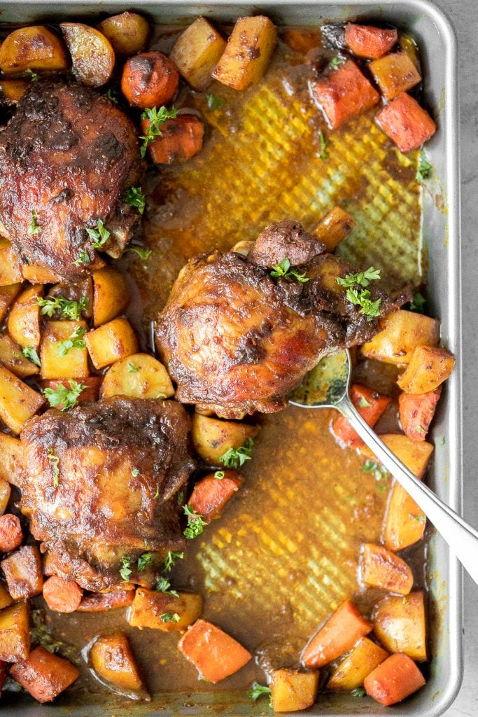 Sheet pan curry chicken and vegetables with tender chicken thighs marinated in a delicious flavourful curry marinade is a complete one pan dinner. | aheadofthyme.com