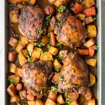 Sheet pan curry chicken and vegetables with tender chicken thighs marinated in a delicious flavourful curry marinade is a complete one pan dinner. | aheadofthyme.com