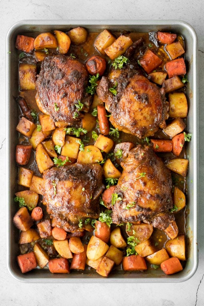 Sheet pan curry chicken and vegetables with tender chicken thighs marinated in a delicious flavourful curry marinade is a complete one pan dinner. | aheadofthyme.com