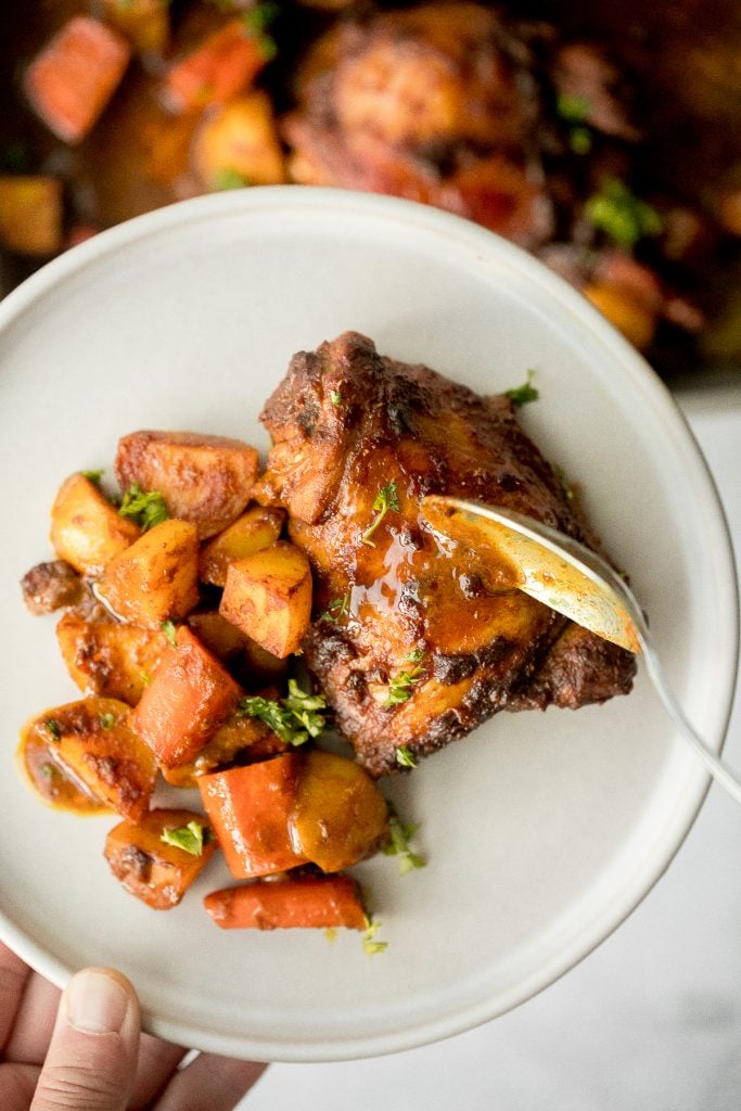 Sheet pan curry chicken and vegetables with tender chicken thighs marinated in a delicious flavourful curry marinade is a complete one pan dinner. | aheadofthyme.com