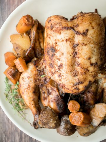 Slow cooker whole chicken is soft and tender and literally falls off the bone. It is the easiest way to cook a rotisserie chicken with a few minutes prep. | aheadofthyme.com