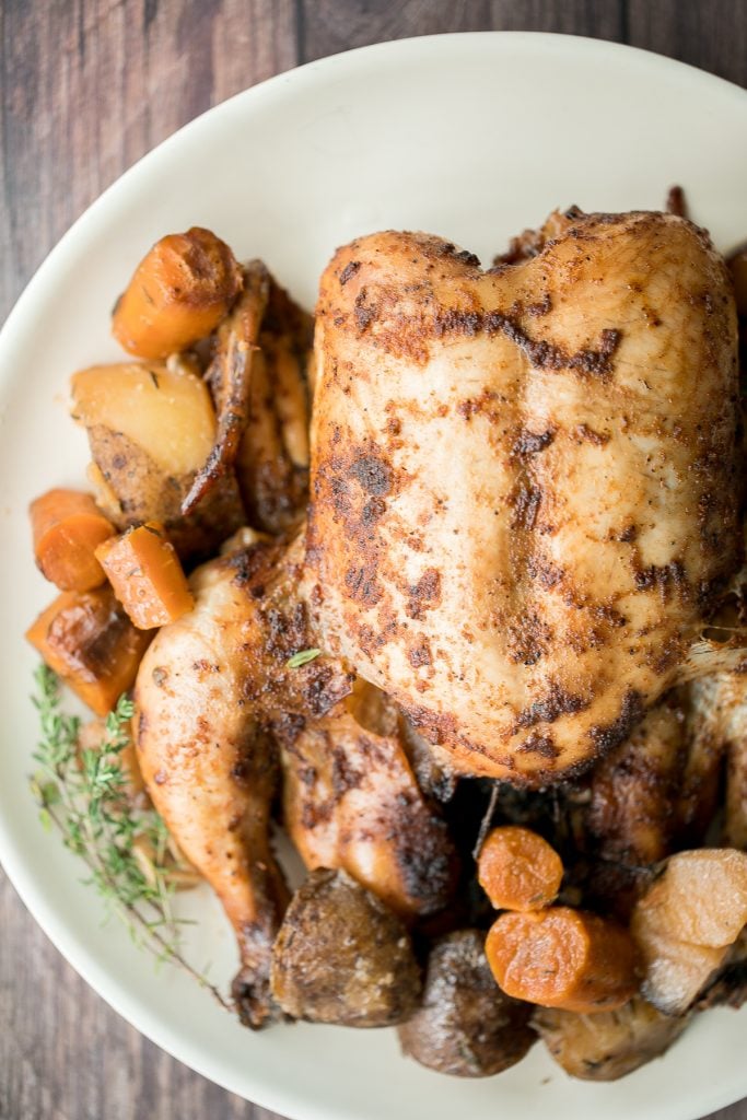 Slow cooker whole chicken is soft and tender and literally falls off the bone. It is the easiest way to cook a rotisserie chicken with a few minutes prep. | aheadofthyme.com