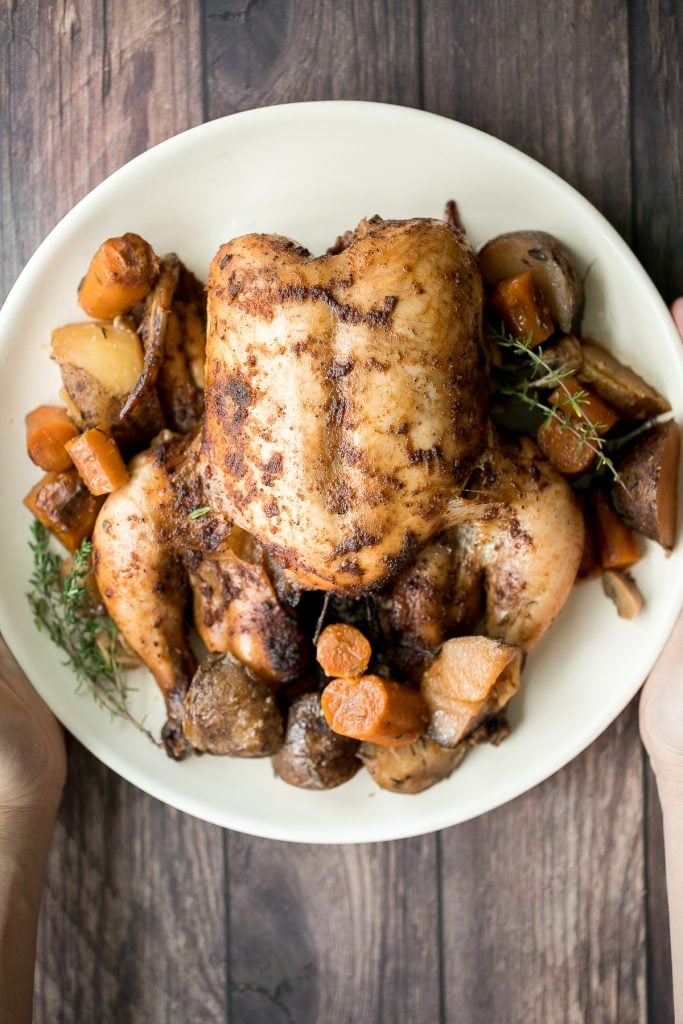 Slow cooker whole chicken is soft and tender and literally falls off the bone. It is the easiest way to cook a rotisserie chicken with a few minutes prep. | aheadofthyme.com