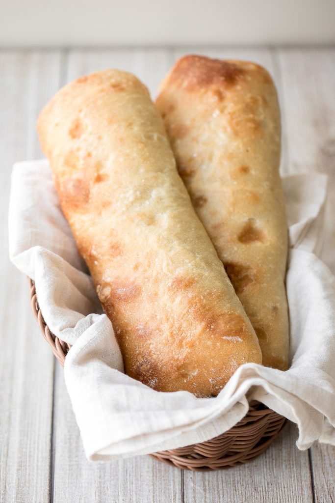 Soft, airy, artisan small batch sourdough ciabatta bread is light and fluffy inside with perfect air holes and a crunchy, crackly crust. Delicious and easy. | aheadofthyme.com
