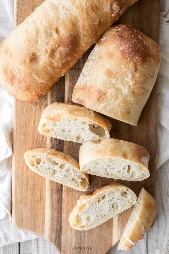 Soft, airy, artisan small batch sourdough ciabatta bread is light and fluffy inside with perfect air holes and a crunchy, crackly crust. Delicious and easy. | aheadofthyme.com