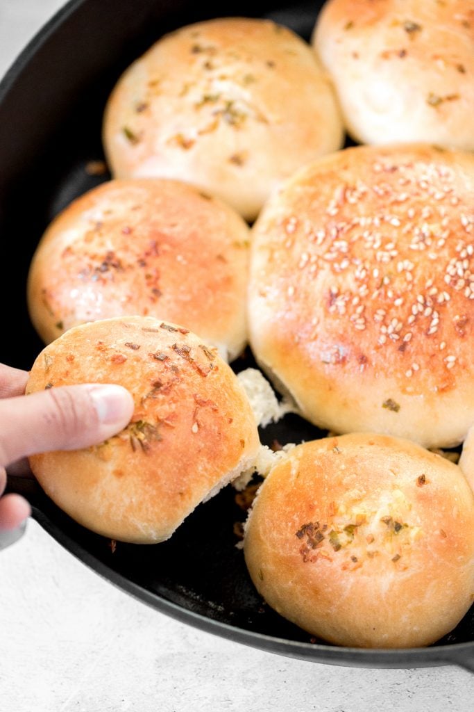 Quick and easy, 90-minute cheesy garlic dinner rolls are soft and fluffy, buttery and garlicky, and full of cheese inside. The perfect side for dinner. | aheadofthyme.com