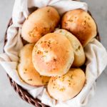 Quick and easy, 90-minute cheesy garlic dinner rolls are soft and fluffy, buttery and garlicky, and full of cheese inside. The perfect side for dinner. | aheadofthyme.com