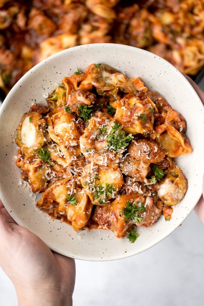 Quick and easy, cheesy tortellini and sausage bake is a delicious 30-minute dinner packed with flavour. A family-favourite comfort food for busy weeknights. | aheadofthyme.com