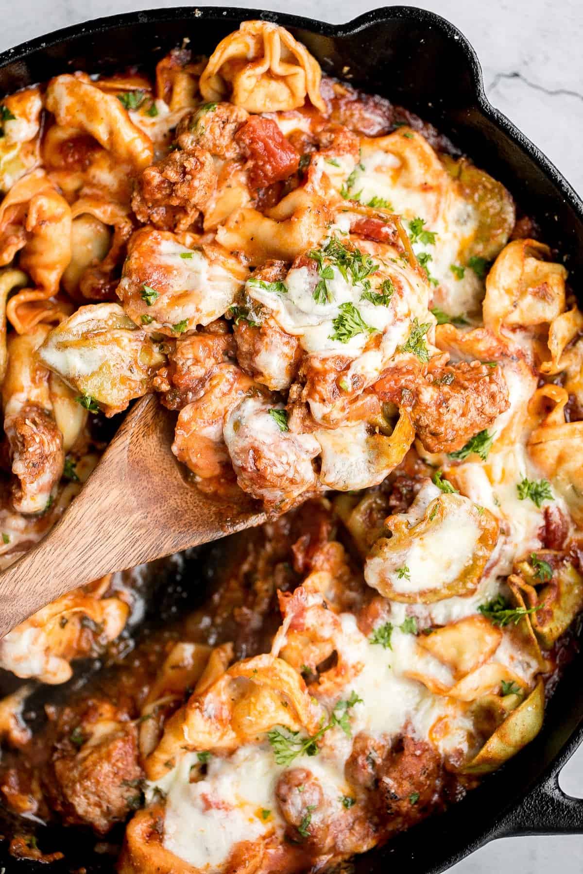 Quick and easy, cheesy tortellini and sausage bake is a delicious 30-minute dinner packed with flavour. A family-favourite comfort food for busy weeknights. | aheadofthyme.com