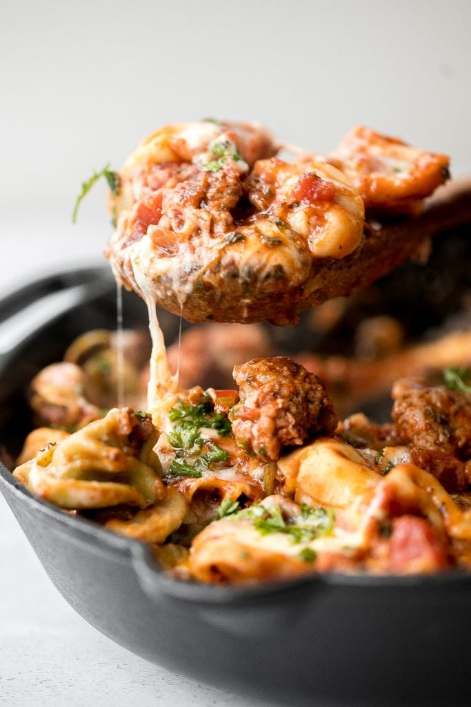 Quick and easy, cheesy tortellini and sausage bake is a delicious 30-minute dinner packed with flavour. A family-favourite comfort food for busy weeknights. | aheadofthyme.com