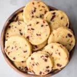 Cranberry orange shortbread cookies are bursting with flavour from dried cranberries and fresh orange zest. These easy cookies are rolled, sliced and baked. | aheadofthyme.com