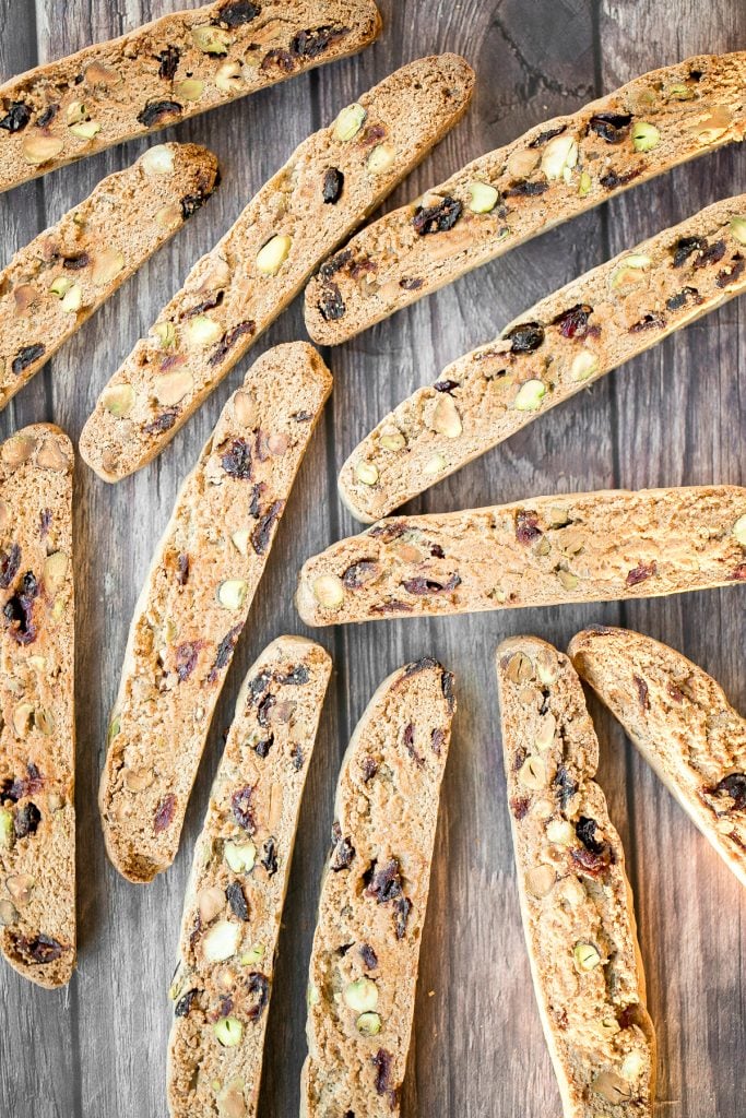 Festive cranberry pistachio biscotti are crunchy, delicious, and perfect for dunking. This Italian cookie is easy to make with warm holiday flavours. | aheadofthyme.com