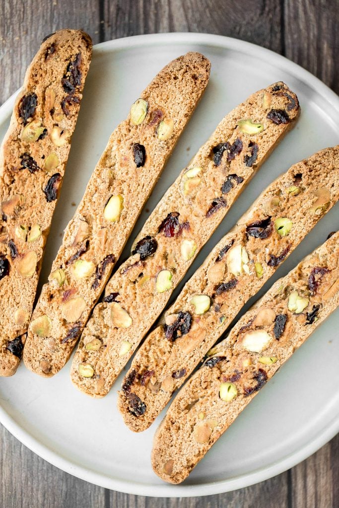 Festive cranberry pistachio biscotti are crunchy, delicious, and perfect for dunking. This Italian cookie is easy to make with warm holiday flavours. | aheadofthyme.com