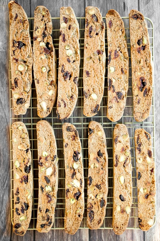 Festive cranberry pistachio biscotti are crunchy, delicious, and perfect for dunking. This Italian cookie is easy to make with warm holiday flavours. | aheadofthyme.com