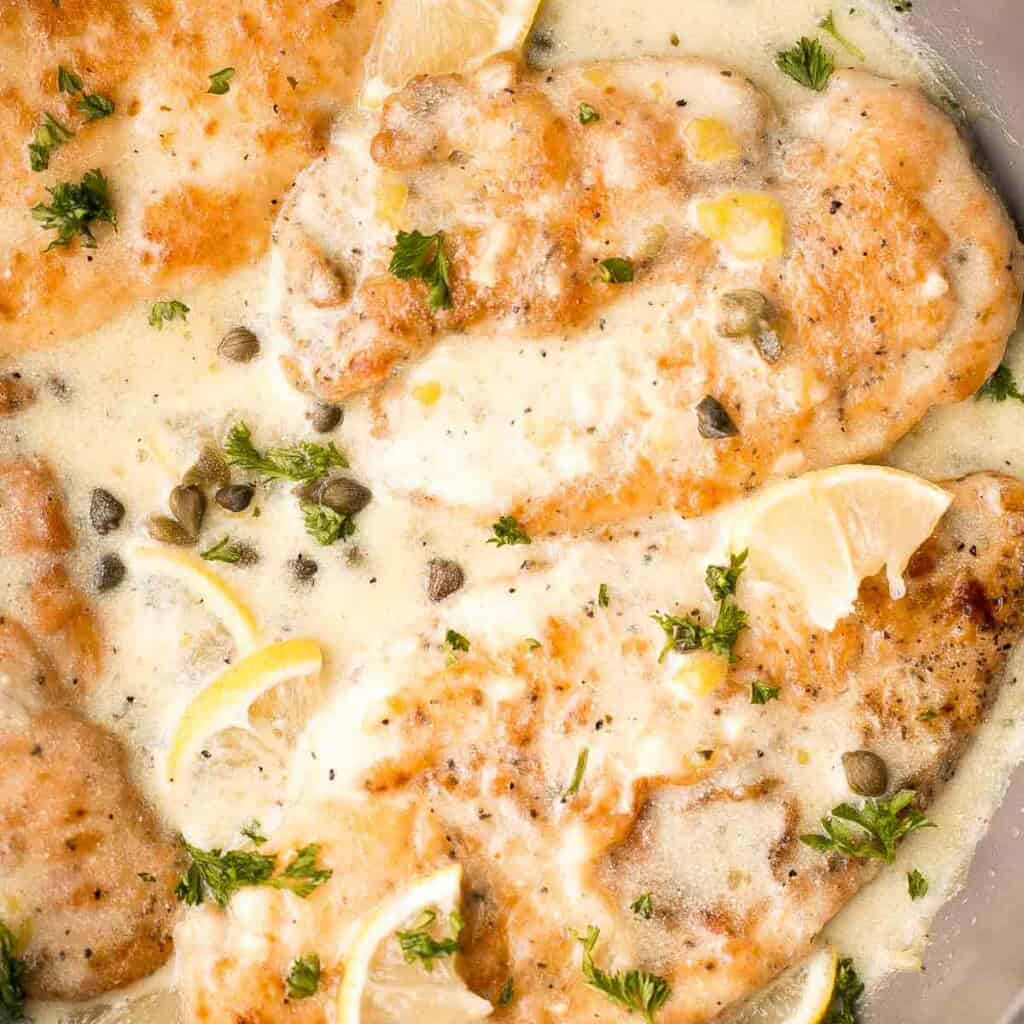 Quick and easy, creamy lemon chicken piccata is a simple and delicious 30-minute meal made with tender chicken breast in a light lemon sauce with capers. | aheadofthyme.com