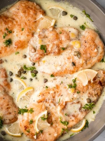 Quick and easy, creamy lemon chicken piccata is a simple and delicious 30-minute meal made with tender chicken breast in a light lemon sauce with capers. | aheadofthyme.com