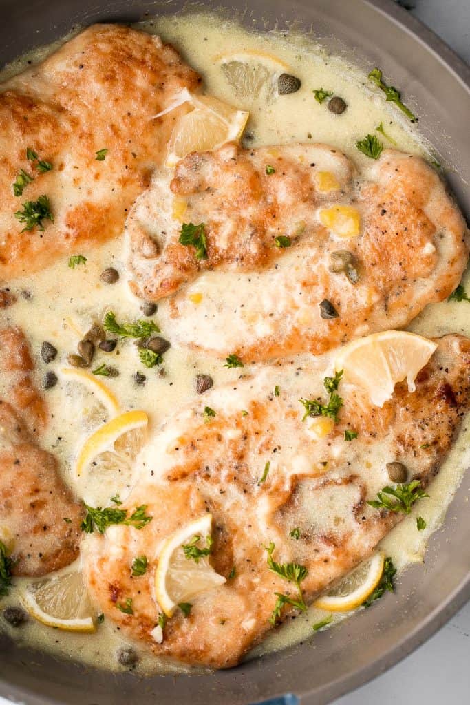 Quick and easy, creamy lemon chicken piccata is a simple and delicious 30-minute meal made with tender chicken breast in a light lemon sauce with capers. | aheadofthyme.com