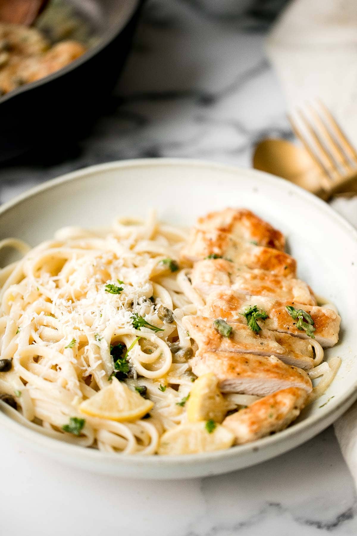 Quick and easy, creamy lemon chicken piccata is a simple and delicious 30-minute meal made with tender chicken breast in a light lemon sauce with capers. | aheadofthyme.com
