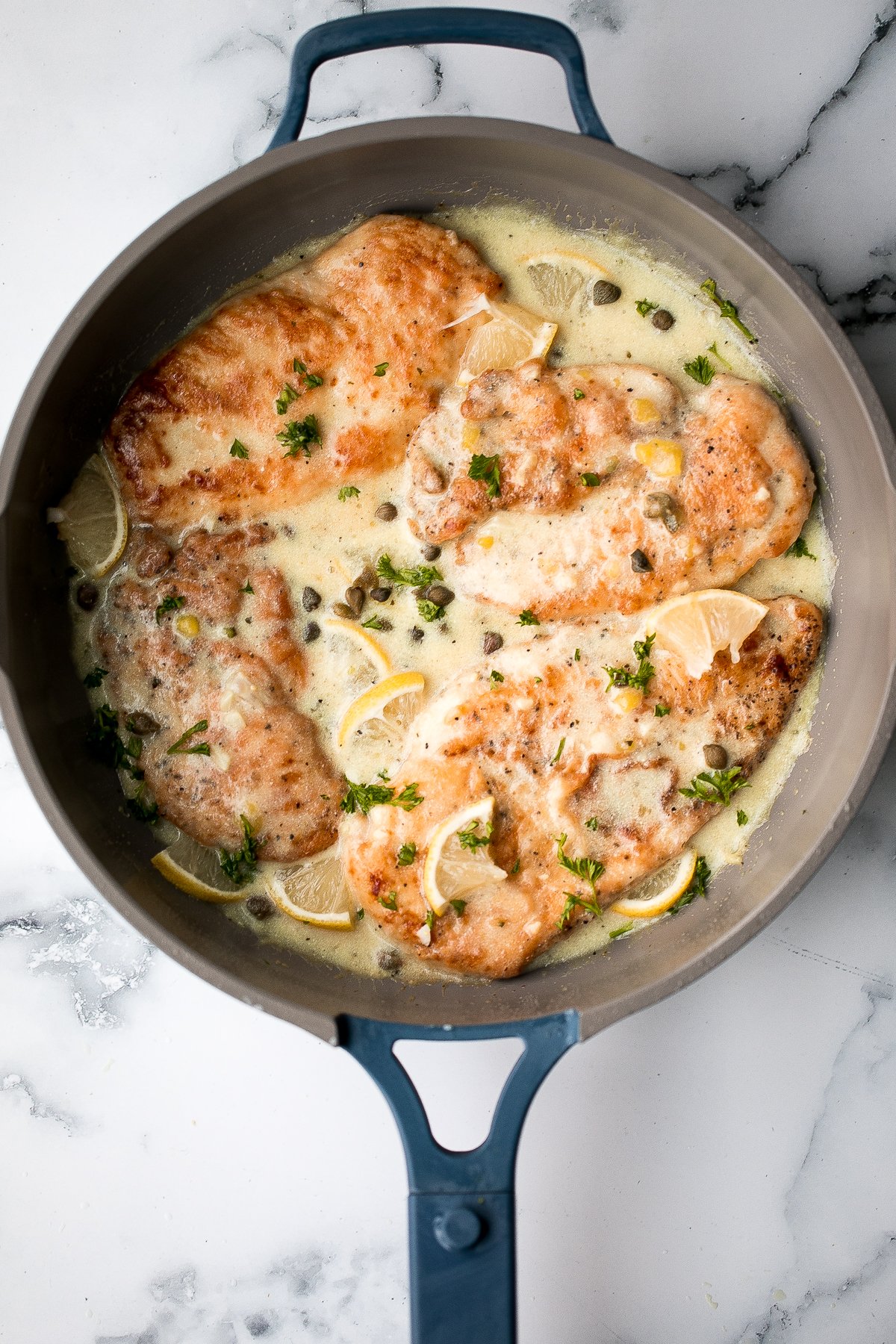 Quick and easy, creamy lemon chicken piccata is a simple and delicious 30-minute meal made with tender chicken breast in a light lemon sauce with capers. | aheadofthyme.com