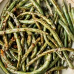 Easy Air Fryer Green Beans are crispy, garlicky, and ready in 10 minutes - a quick, flavorful side for any meal. | aheadofthyme.com