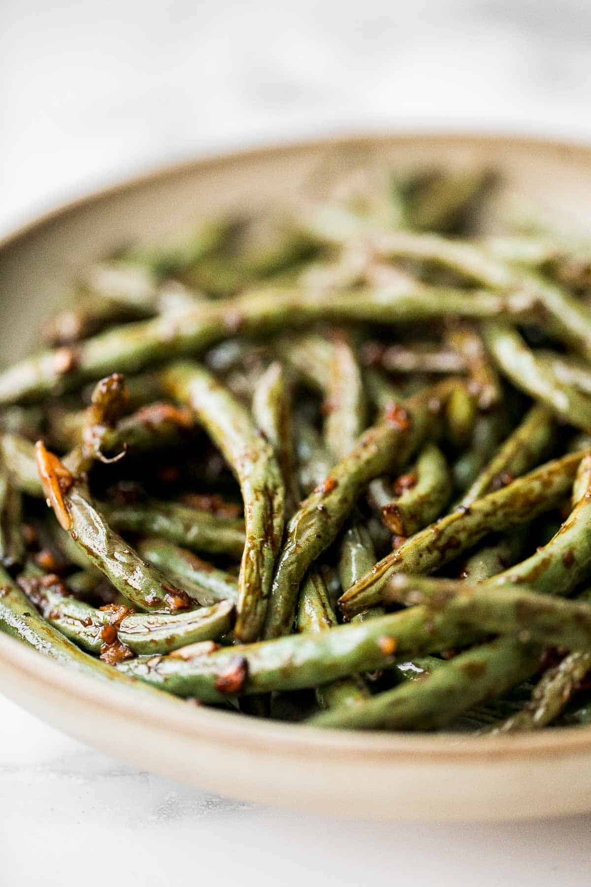Easy Air Fryer Green Beans are crispy, garlicky, and ready in 10 minutes — a quick, flavorful side for any meal. | aheadofthyme.com