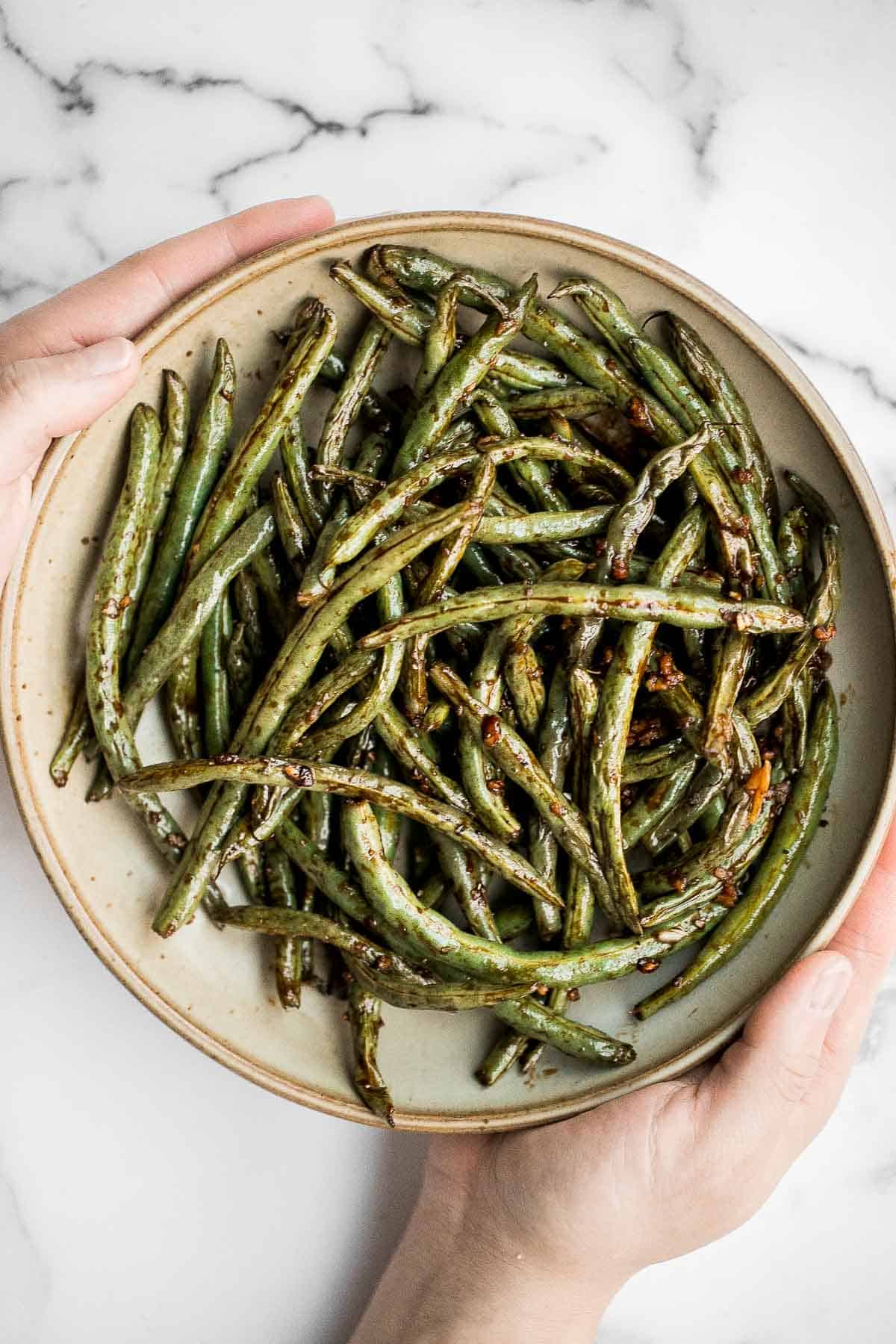 Easy Air Fryer Green Beans are crispy, garlicky, and ready in 10 minutes — a quick, flavorful side for any meal. | aheadofthyme.com