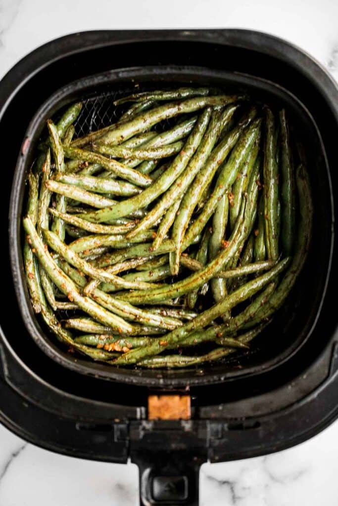 Easy Air Fryer Green Beans are crispy, garlicky, and ready in 10 minutes — a quick, flavorful side for any meal. | aheadofthyme.com