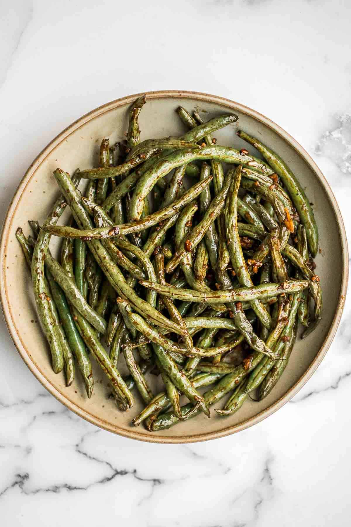 Easy Air Fryer Green Beans are crispy, garlicky, and ready in 10 minutes — a quick, flavorful side for any meal. | aheadofthyme.com