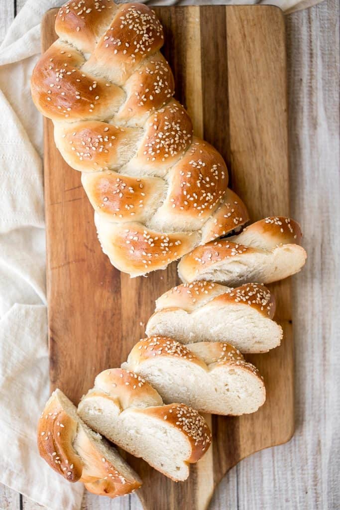 Beautiful three-strand braided loaves of easy challah bread are light, soft and fluffy, with a golden brown crust. Rich in flavour and slightly sweet. | aheadofthyme.com