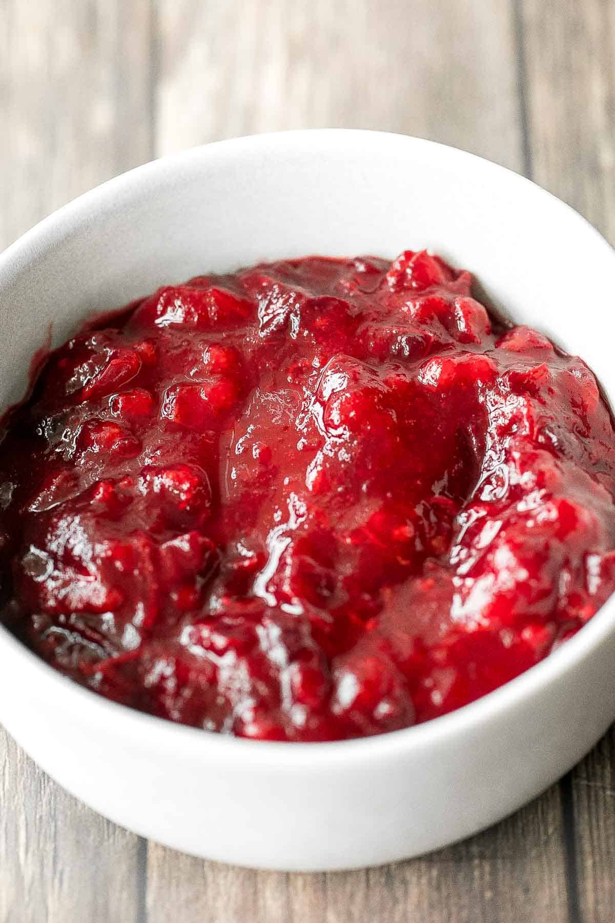 Take the stress out of the holidays and prepare easy make-ahead cranberry sauce days before Thanksgiving dinner in 15 minutes with just 3 ingredients. | aheadofthyme.com