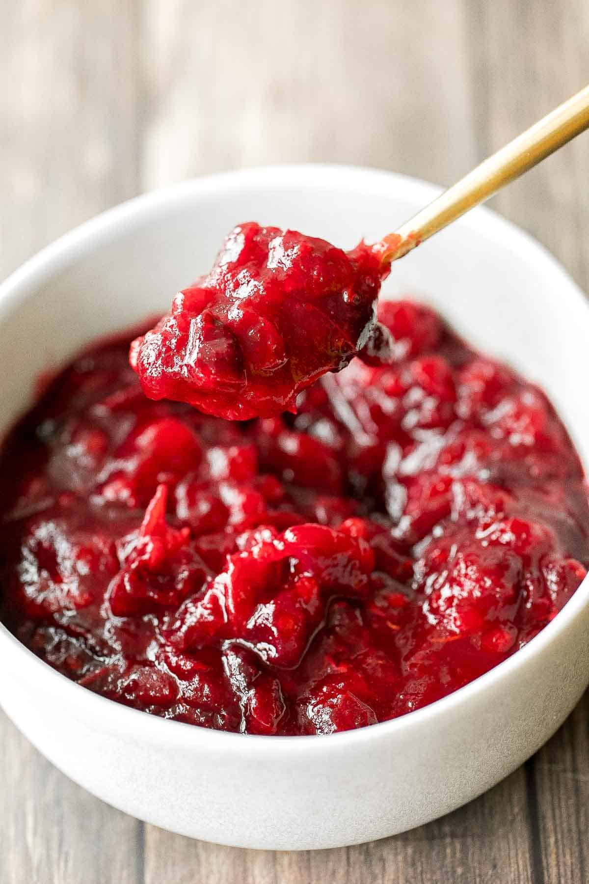 Take the stress out of the holidays and prepare easy make-ahead cranberry sauce days before Thanksgiving dinner in 15 minutes with just 3 ingredients. | aheadofthyme.com