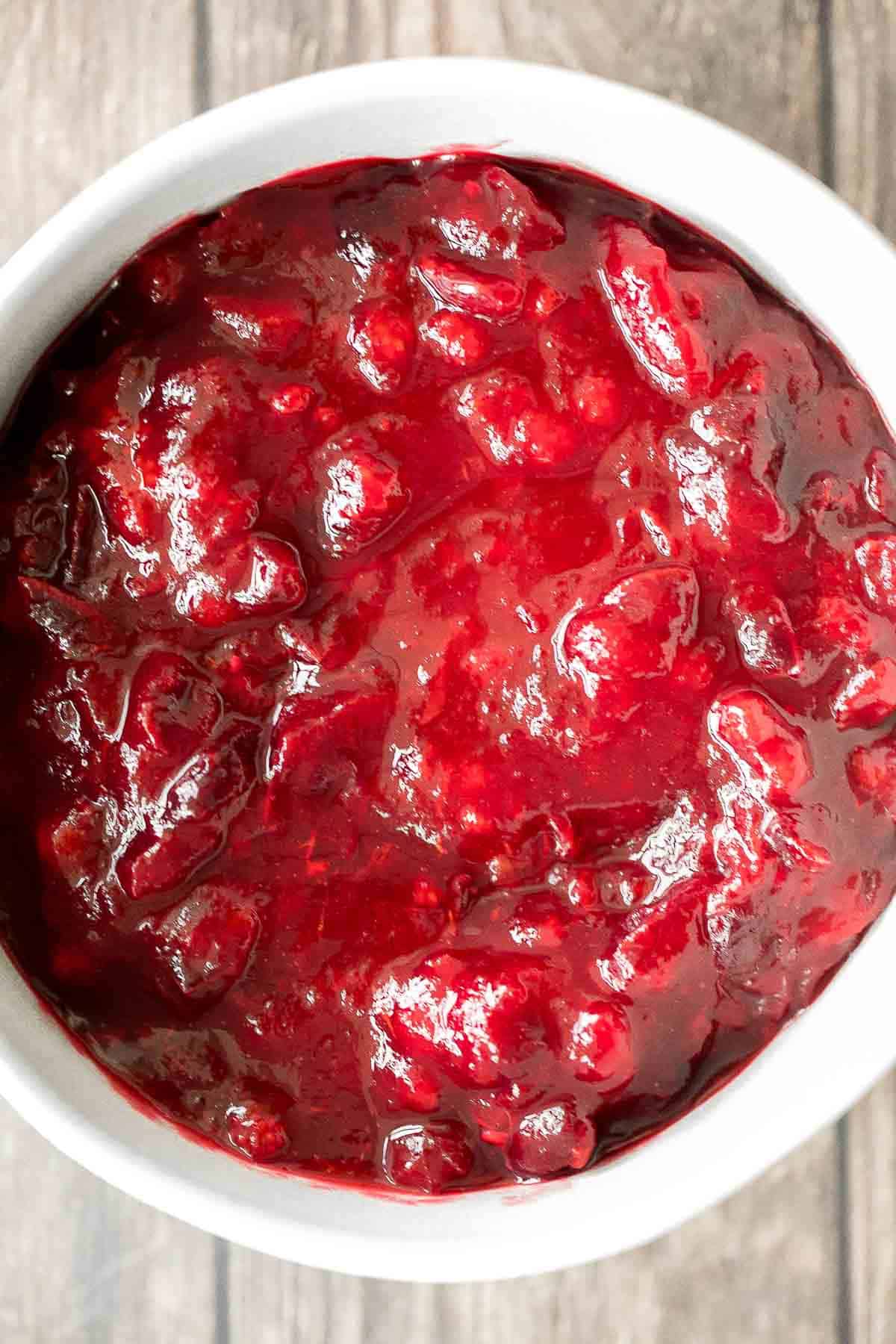 Take the stress out of the holidays and prepare easy make-ahead cranberry sauce days before Thanksgiving dinner in 15 minutes with just 3 ingredients. | aheadofthyme.com