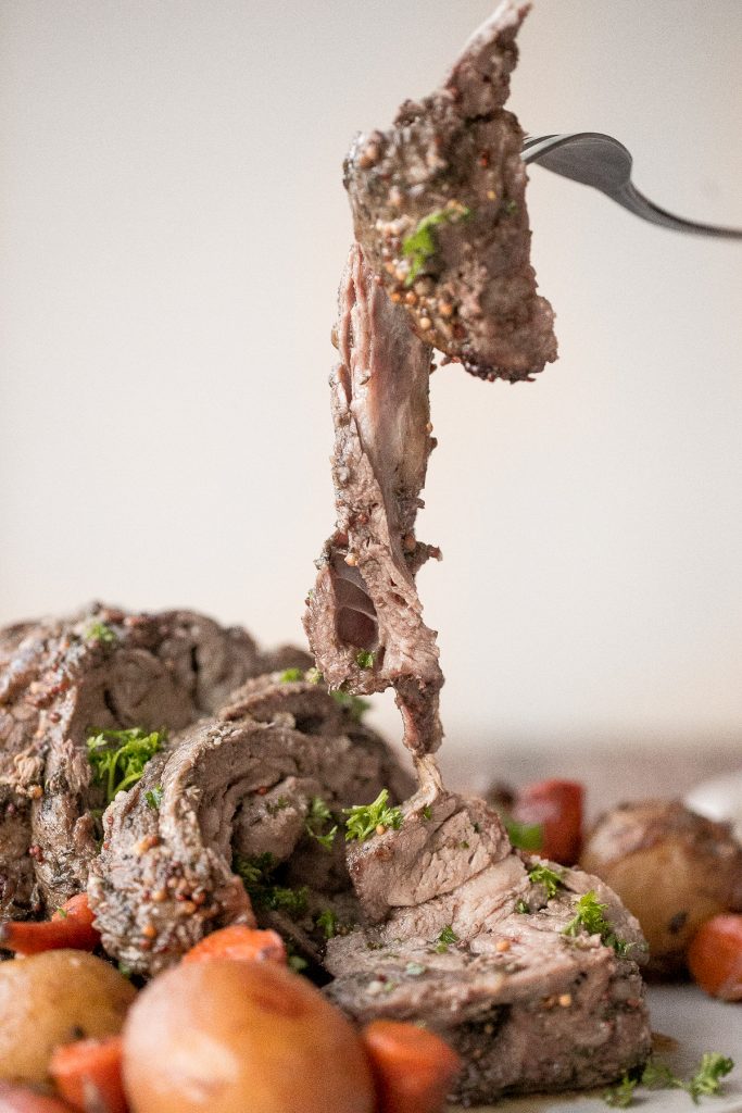 Easy roast lamb with vegetables is tender, juicy, and succulent and packed incredible flavour. This fancy holiday dinner is easy to prep in just 15 minutes. | aheadofthyme.com