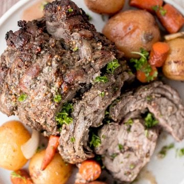 Easy roast lamb with vegetables is tender, juicy, and succulent and packed incredible flavour. This fancy holiday dinner is easy to prep in just 15 minutes. | aheadofthyme.com