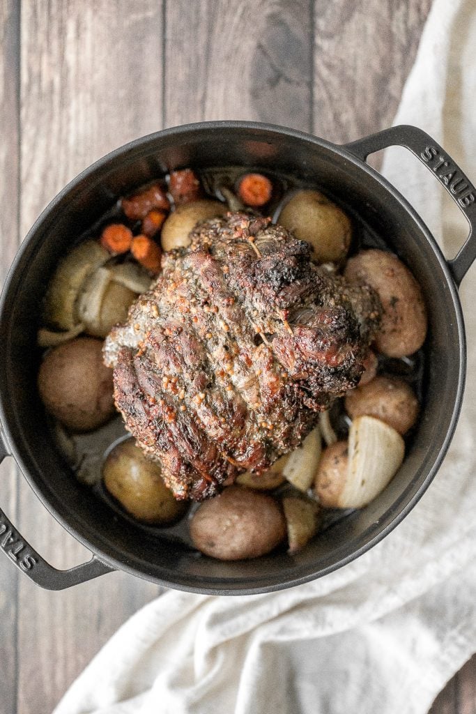 Easy roast lamb with vegetables is tender, juicy, and succulent and packed incredible flavour. This fancy holiday dinner is easy to prep in just 15 minutes. | aheadofthyme.com