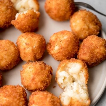 Fried mac and cheese balls are crispy on the outside, creamy and cheesy on the inside, and have the perfect crunch. Best way to use leftover mac and cheese. | aheadofthyme.com