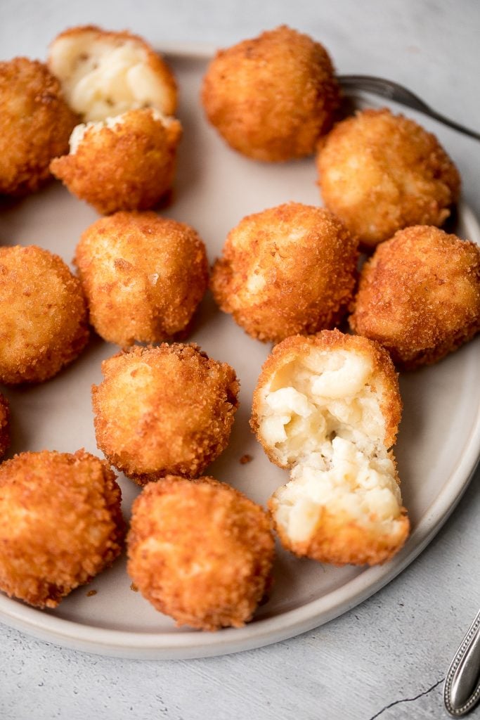 Fried mac and cheese balls are crispy on the outside, creamy and cheesy on the inside, and have the perfect crunch. Best way to use leftover mac and cheese. | aheadofthyme.com