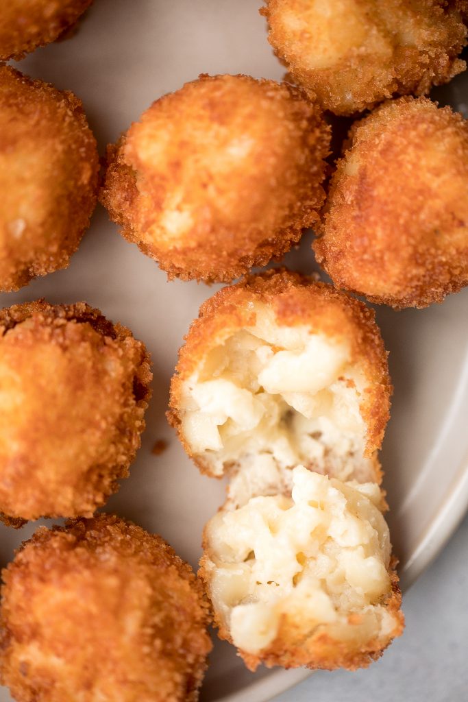 Fried mac and cheese balls are crispy on the outside, creamy and cheesy on the inside, and have the perfect crunch. Best way to use leftover mac and cheese. | aheadofthyme.com