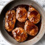 Quick and easy, glazed honey balsamic pork chops are tender and juicy, seared in thyme and coated with a honey balsamic sauce. Make it in under 30 minutes. | aheadofthyme.com