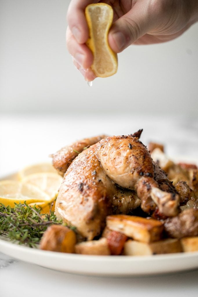 Easy Greek lemon garlic whole roast chicken is tender, juicy and succulent with the crispiest skin. Prep this flavourful one pan meal in just 15 minutes. | aheadofthyme.com