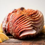 Easy holiday glazed baked ham is juicy, succulent and flavourful, coated in a brown sugar honey glaze with and baked until caramelized and golden brown. | aheadofthyme.com