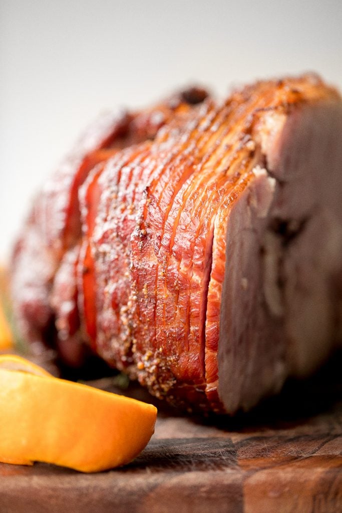 Easy holiday glazed baked ham is juicy, succulent and flavourful, coated in a brown sugar honey glaze with and baked until caramelized and golden brown. | aheadofthyme.com