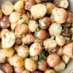 Quick and easy roasted garlic Parmesan baby potatoes are crispy on the edges and tender inside. They are delicious, flavourful and bakes in just 30 minutes. | aheadofthyme.com