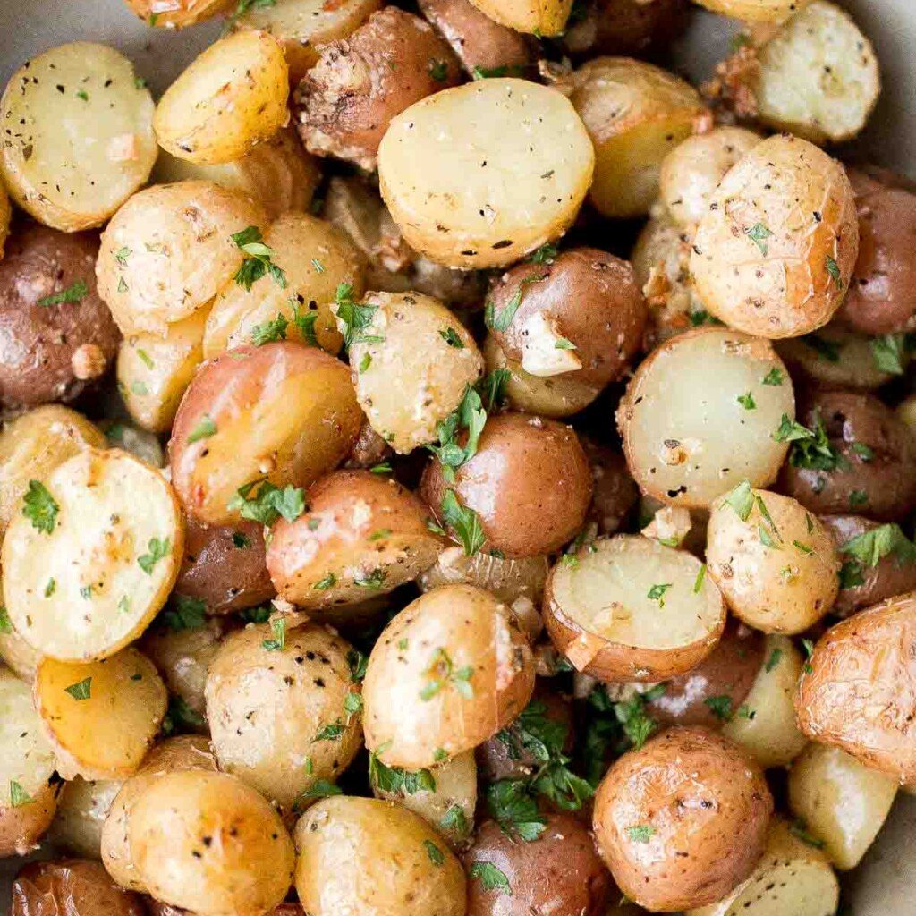 Crispy roasted garlic Parmesan baby potatoes are golden, cheesy, and flavorful. An easy 40-minute side dish perfect for dinner or holidays. | aheadofthyme.com