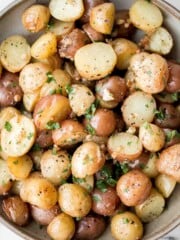 Crispy roasted garlic Parmesan baby potatoes are golden, cheesy, and flavorful. An easy 40-minute side dish perfect for dinner or holidays. | aheadofthyme.com