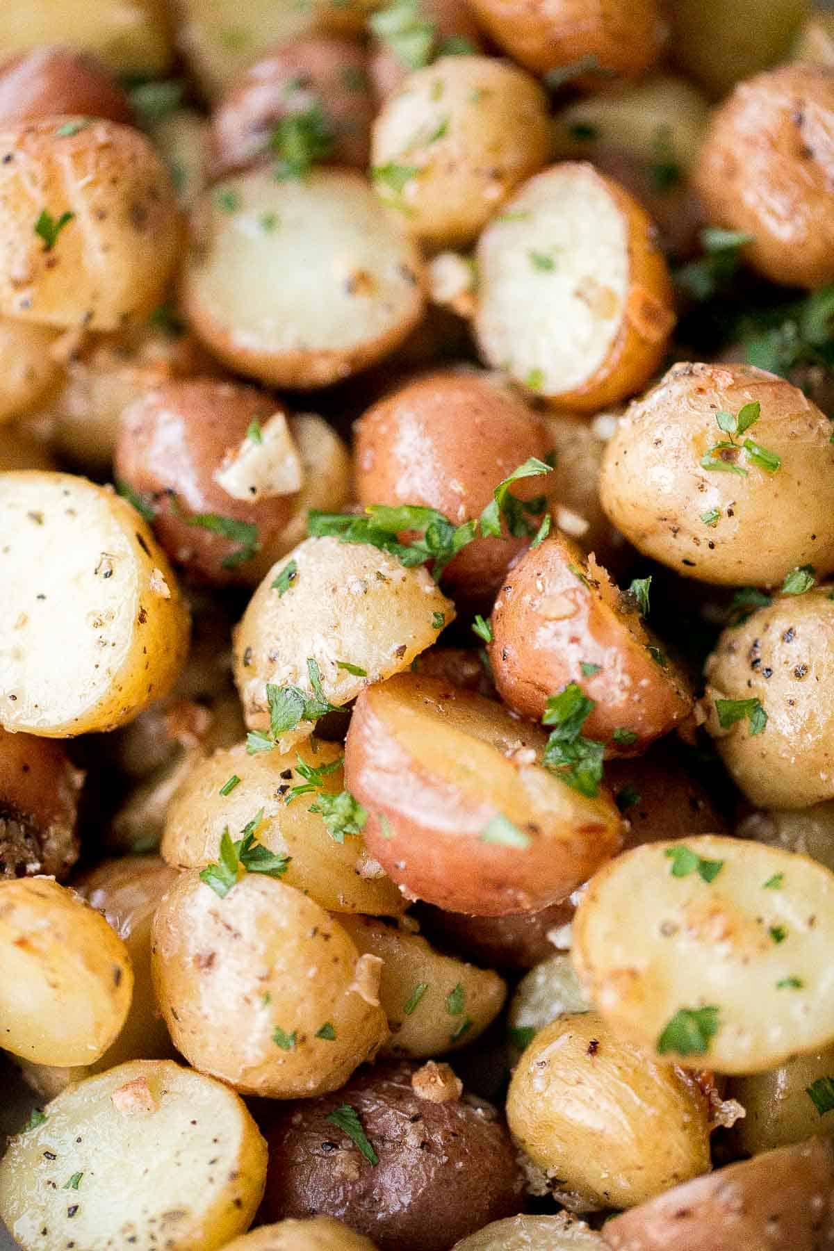 Crispy roasted garlic Parmesan baby potatoes are golden, cheesy, and flavorful. An easy 40-minute side dish perfect for dinner or holidays. | aheadofthyme.com