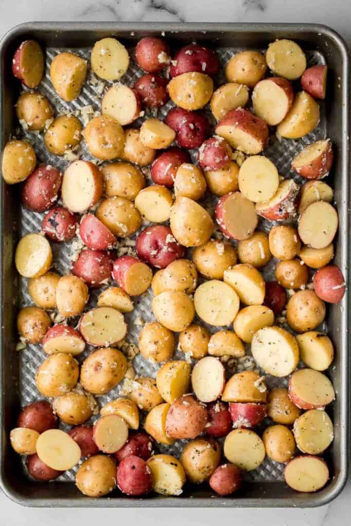 Crispy roasted garlic Parmesan baby potatoes are golden, cheesy, and flavorful. An easy 40-minute side dish perfect for dinner or holidays. | aheadofthyme.com