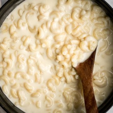 Quick and easy, creamy stovetop mac and cheese with white cheddar is a delicious and comforting one pot 20-minute meal packed with three types of cheese. | aheadofthyme.com