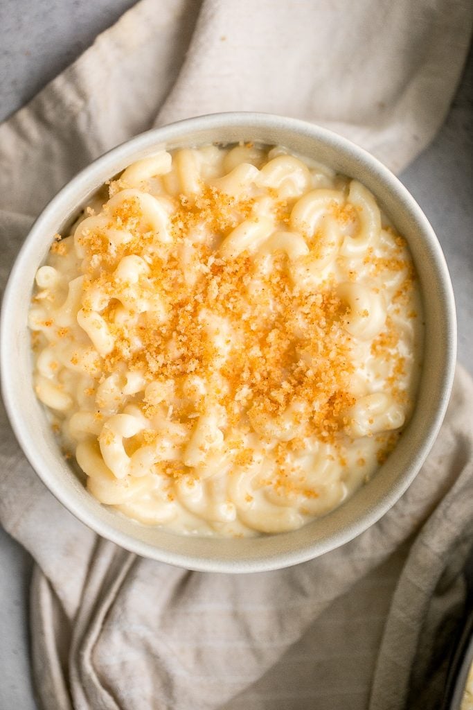 Quick and easy, creamy stovetop mac and cheese with white cheddar is a delicious and comforting one pot 20-minute meal packed with three types of cheese. | aheadofthyme.com