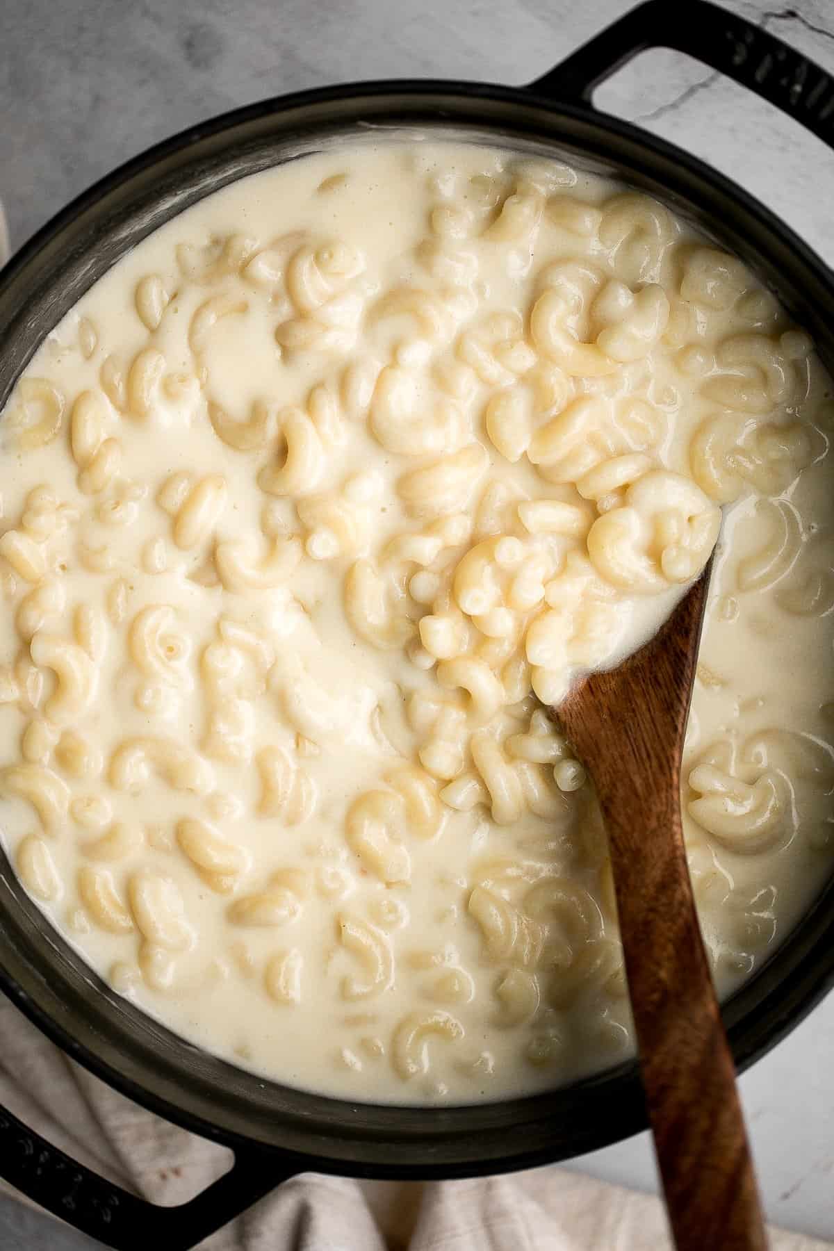 Quick and easy, creamy stovetop mac and cheese with white cheddar is a delicious and comforting one pot 20-minute meal packed with three types of cheese. | aheadofthyme.com